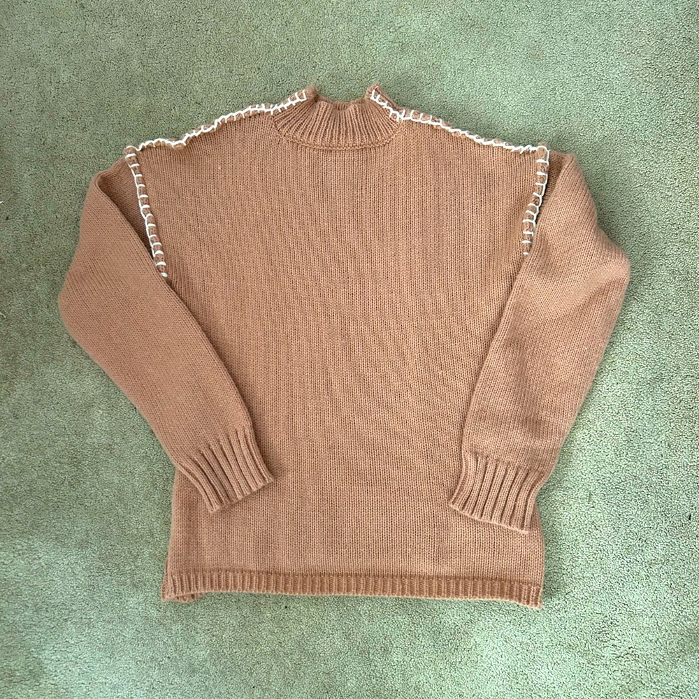 Woman’s size small warm peach sweater. NWOT. Never been worn.
